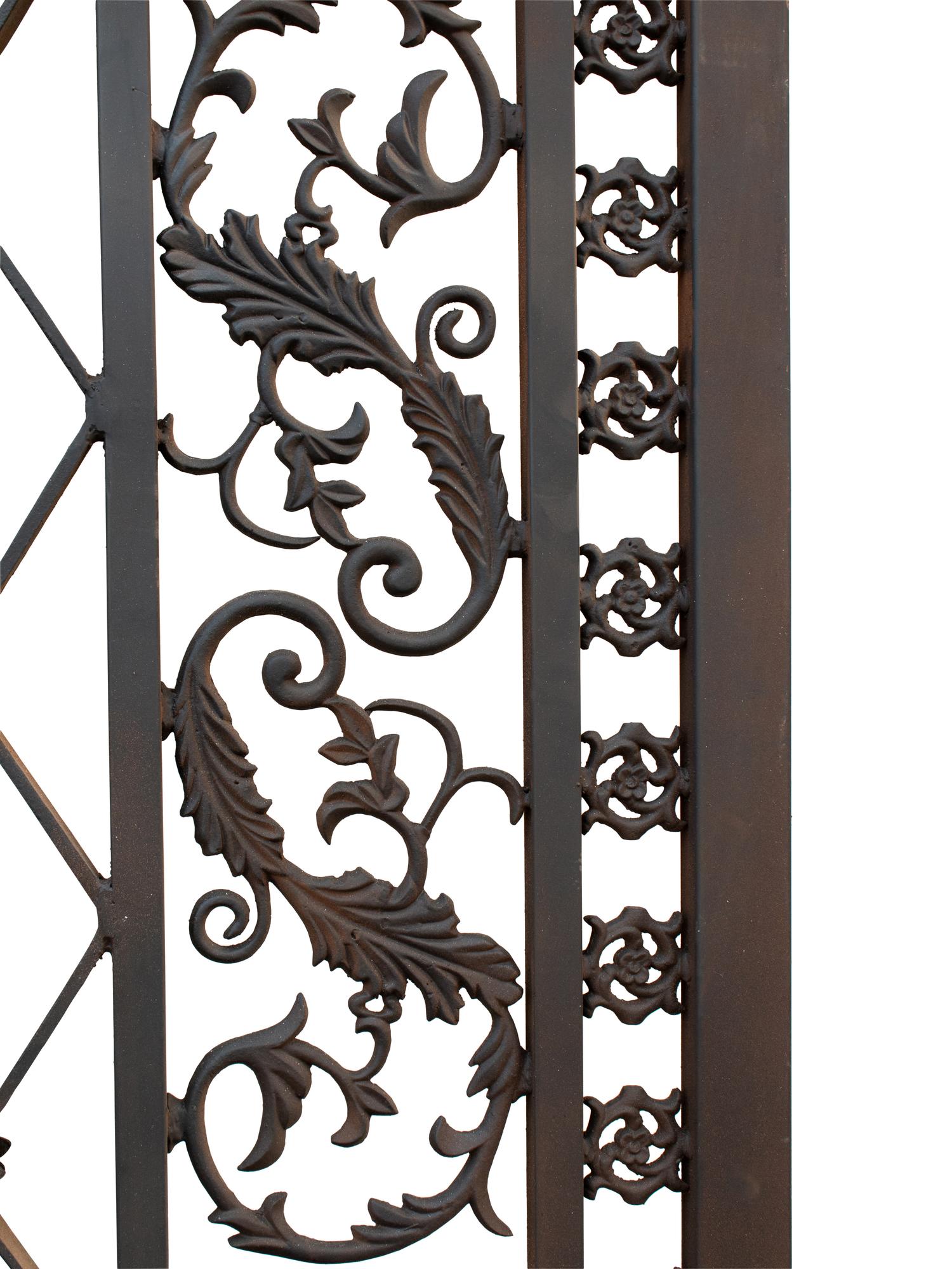 A Pair of Gates with Gilt Rampant Lion Ornaments