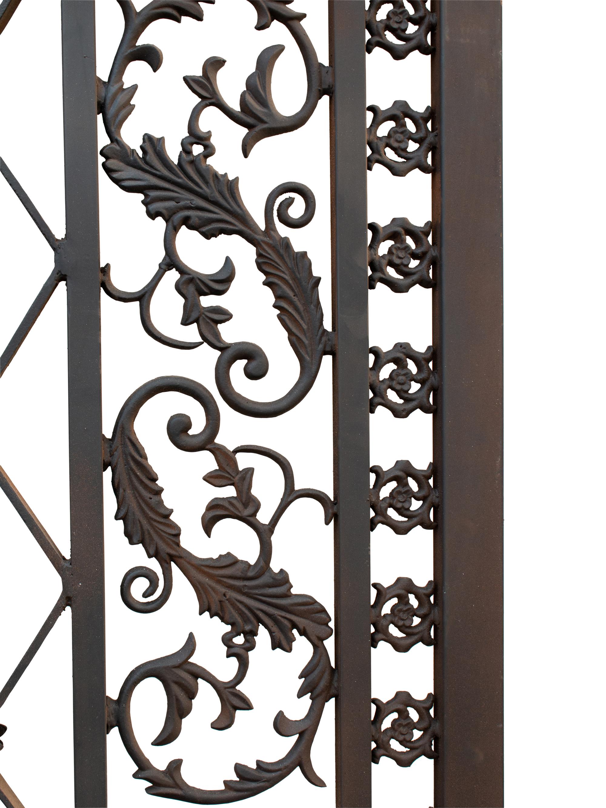 A Pair of Gates with Gilt Rampant Lion Ornaments