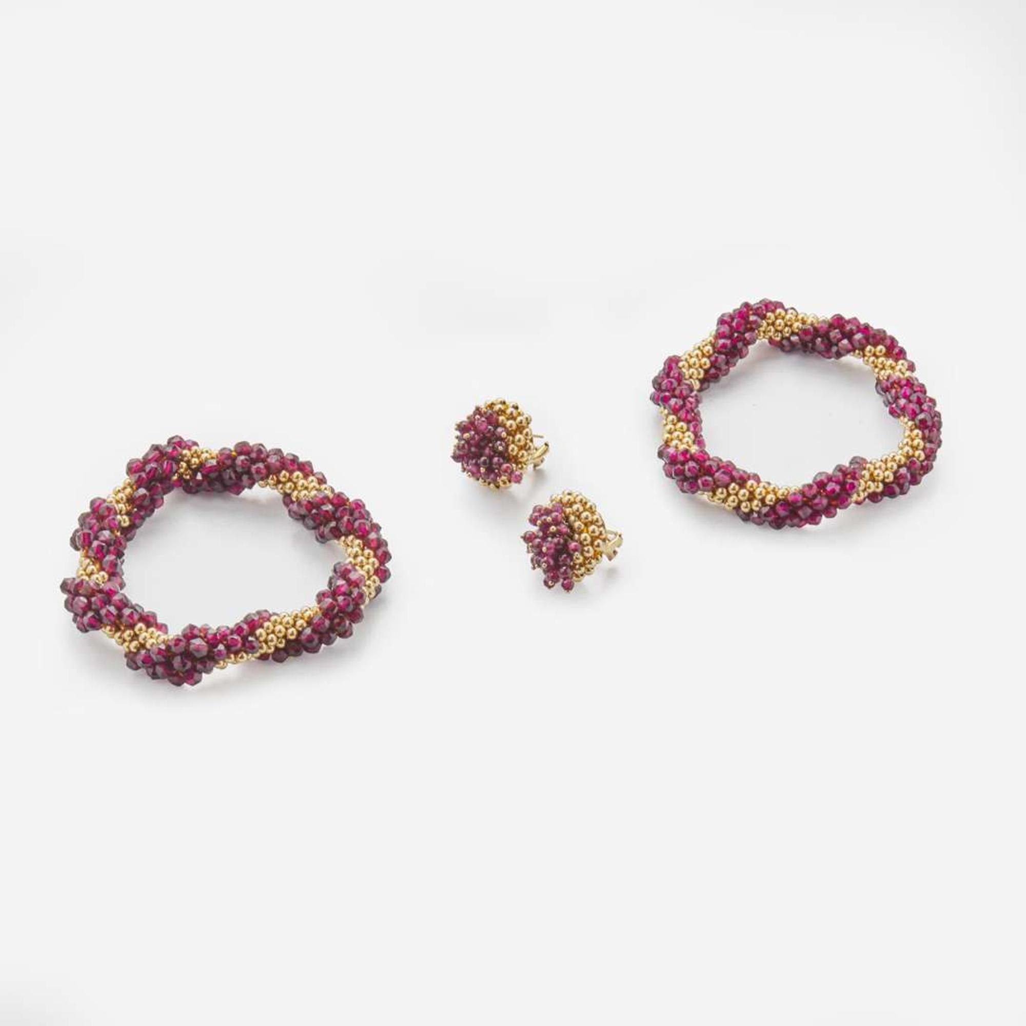 A Matching Set of Garnet and 14K Yellow Gold Bracelets and Earrings