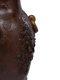 A Pair of Louis XVI Style Gilt and Patinated Bronze Six-Light Candelabra