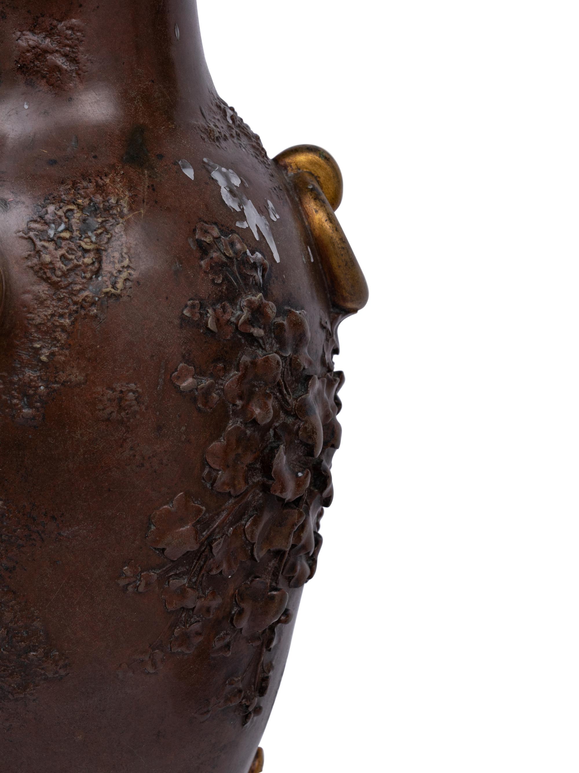 A Pair of Louis XVI Style Gilt and Patinated Bronze Six-Light Candelabra