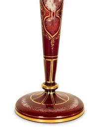 A Set of Four Bohemian Ruby Cut-to-Clear Glass Candlesticks with Gilt Decoration. — 19th Century