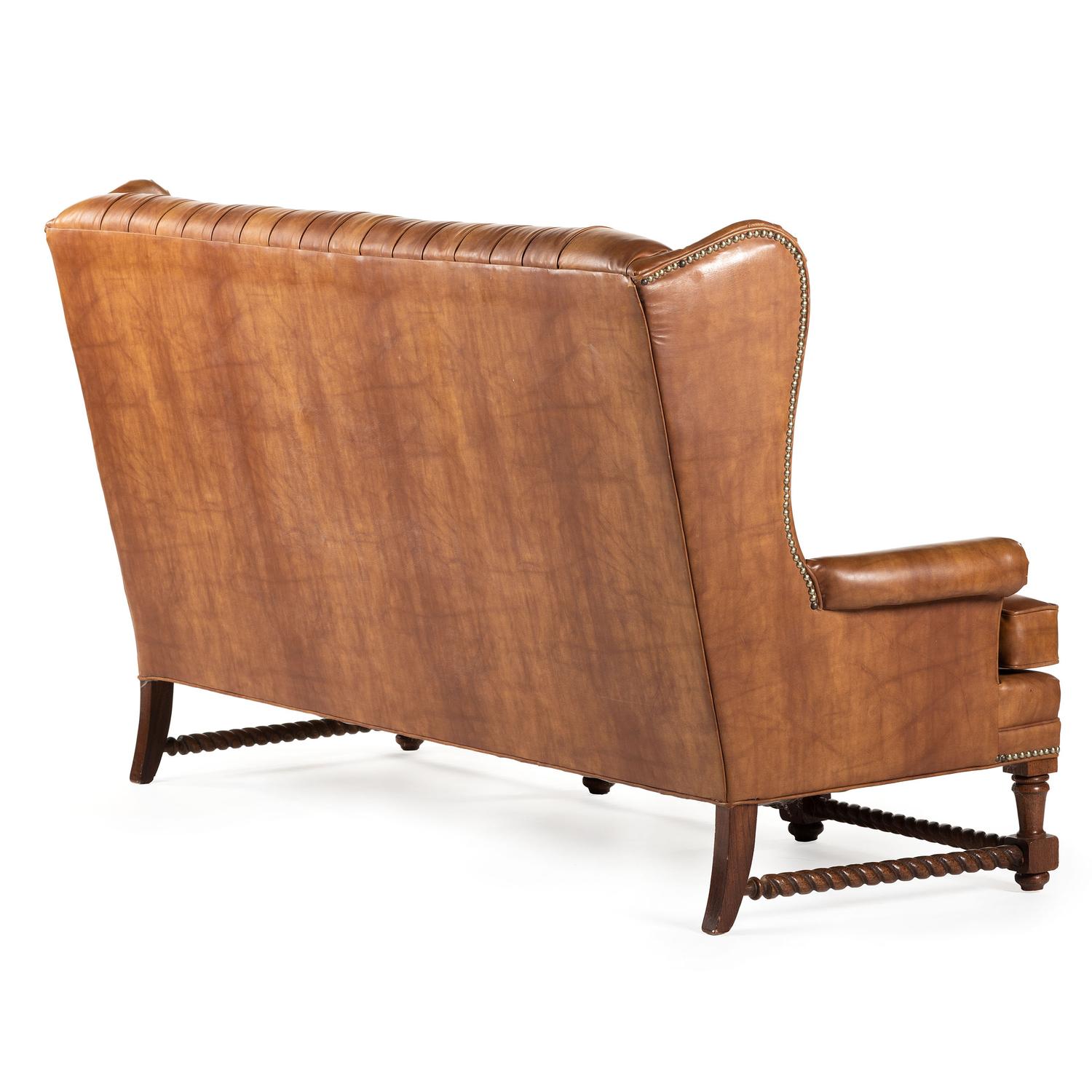 A Set of Leather Upholstered Button Tufted Wingback Sofas and Armchair