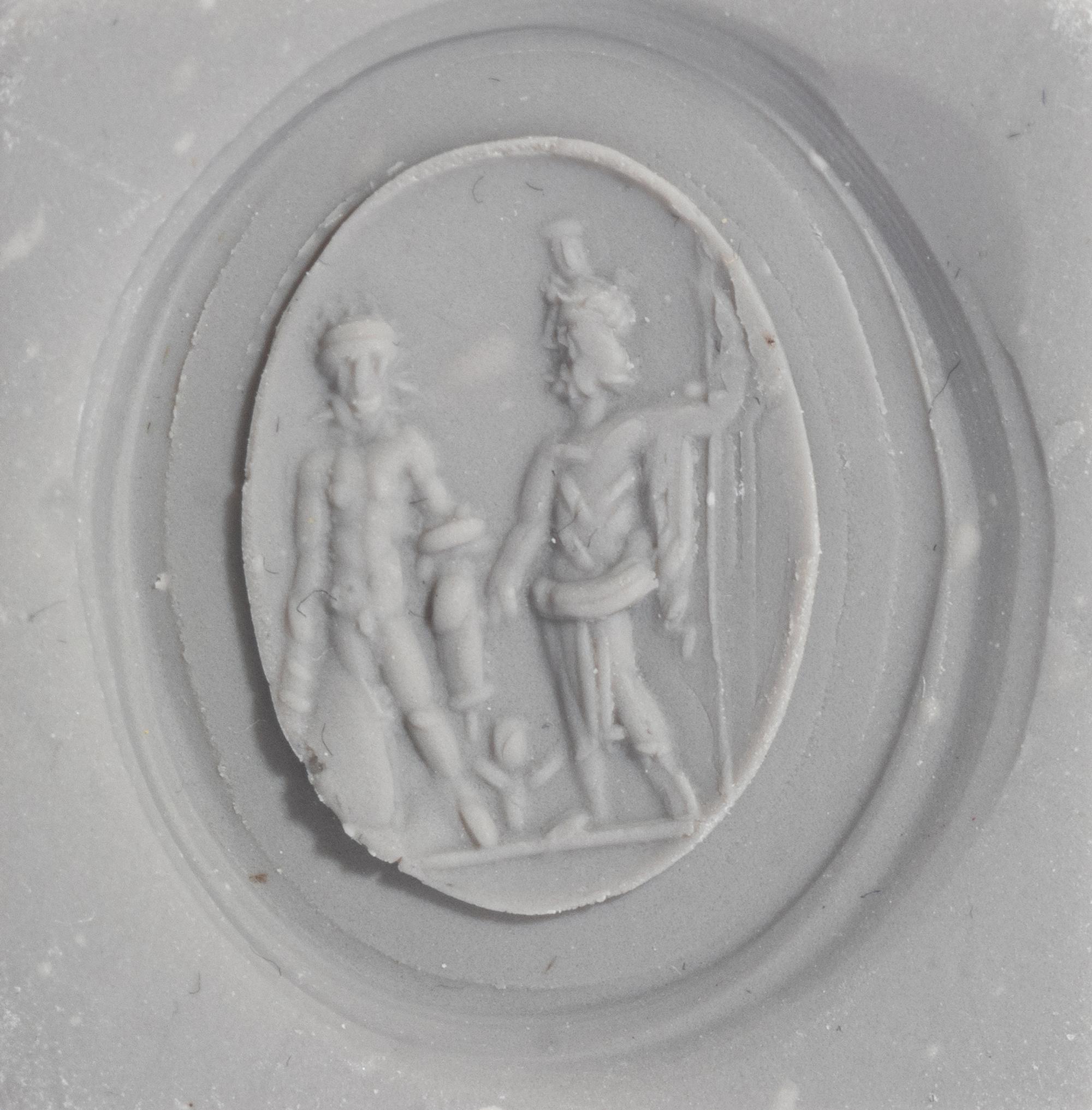 A Roman Carnelian Ring Stone with Two Male Deities and a Child — Set in a gold ring