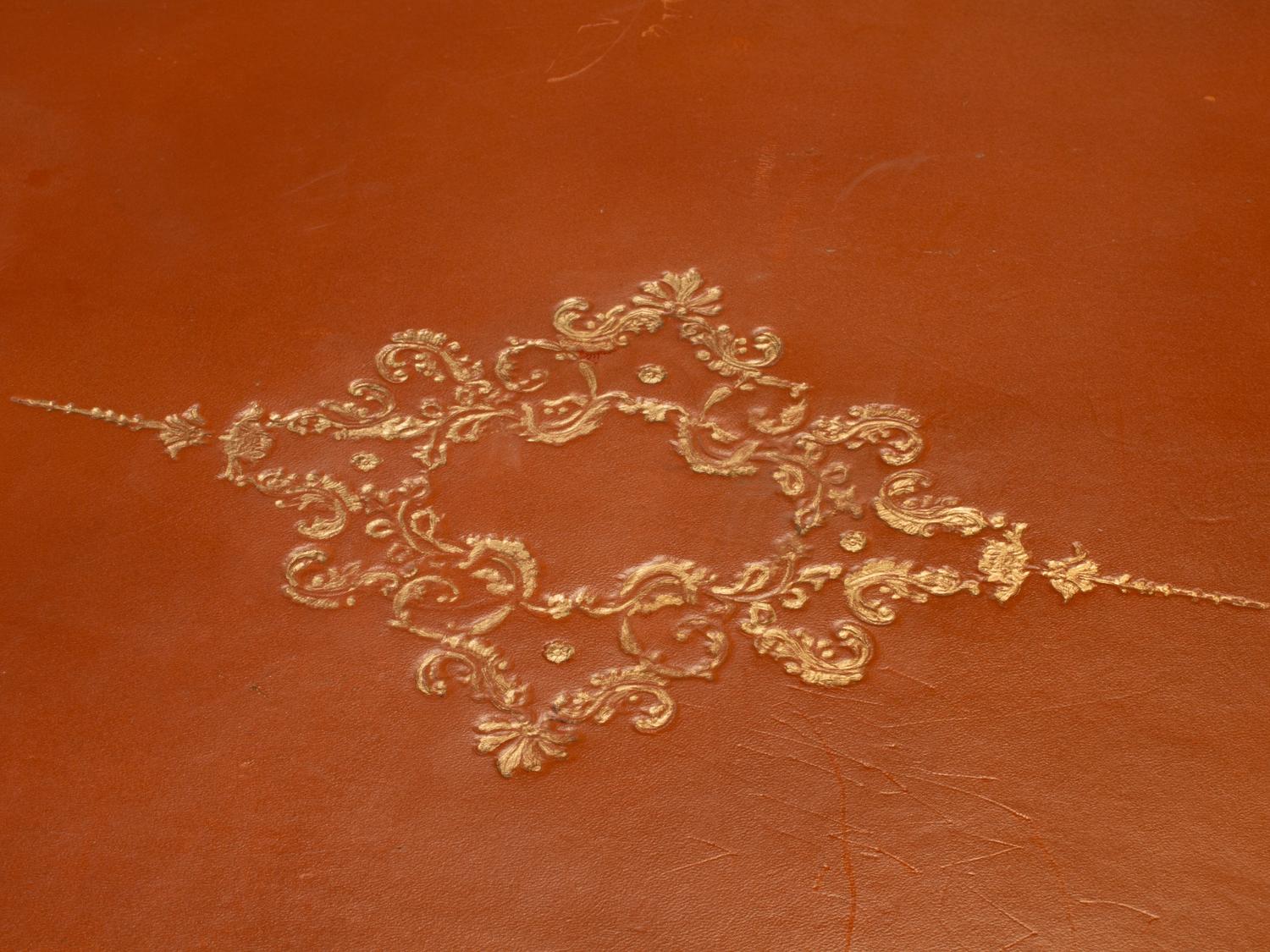 A French Provincial Fruitwood and Tooled Leather Writing Table