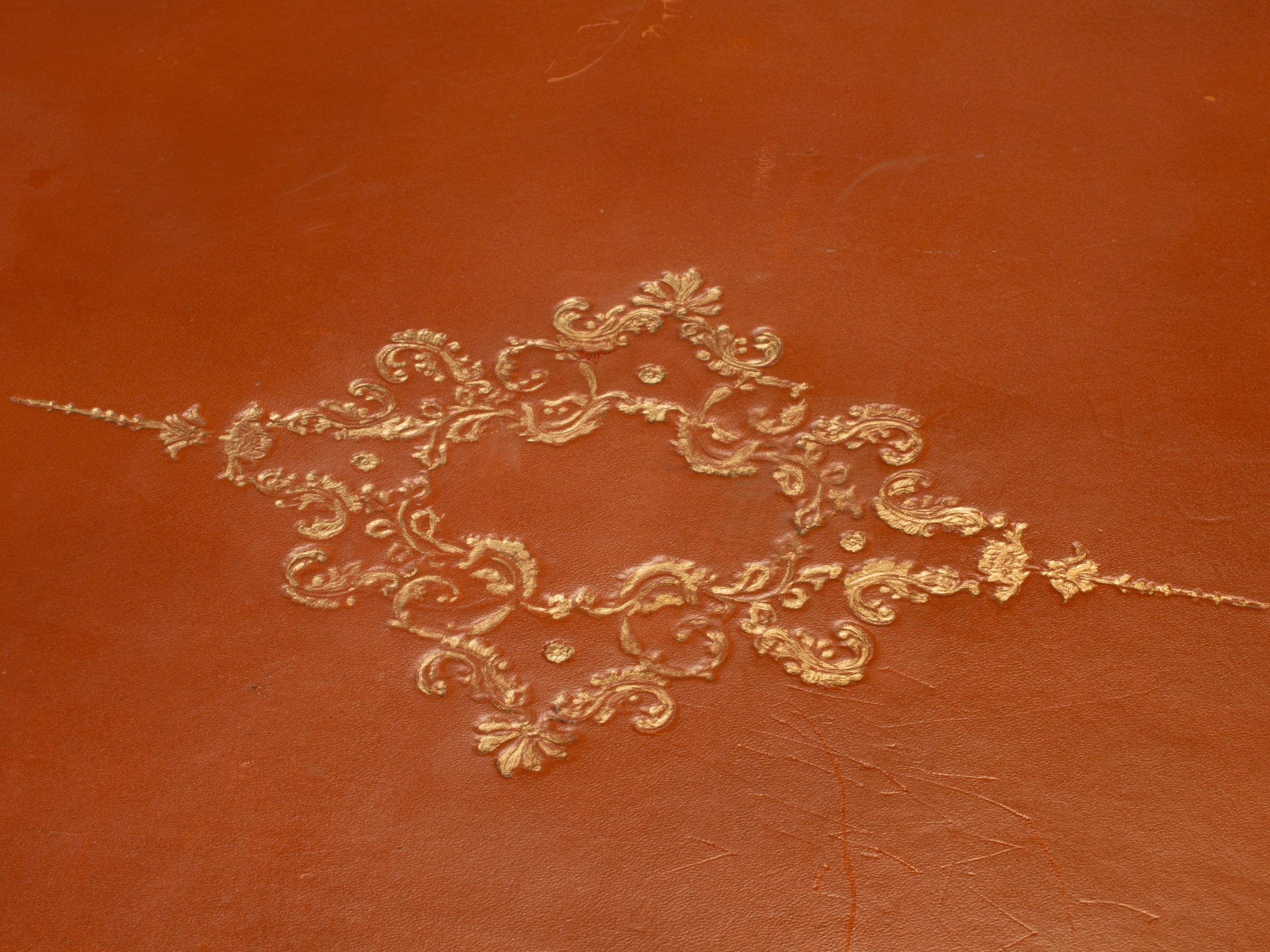 A French Provincial Fruitwood and Tooled Leather Writing Table