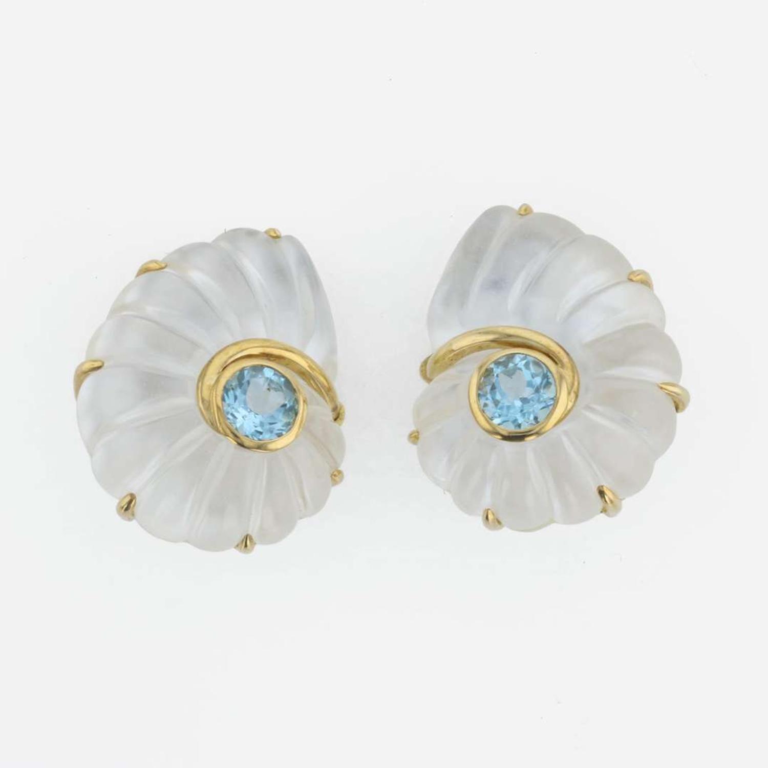 A pair of 18K yellow gold, rock crystal, and blue topaz ear clips, Trianon Nautilus