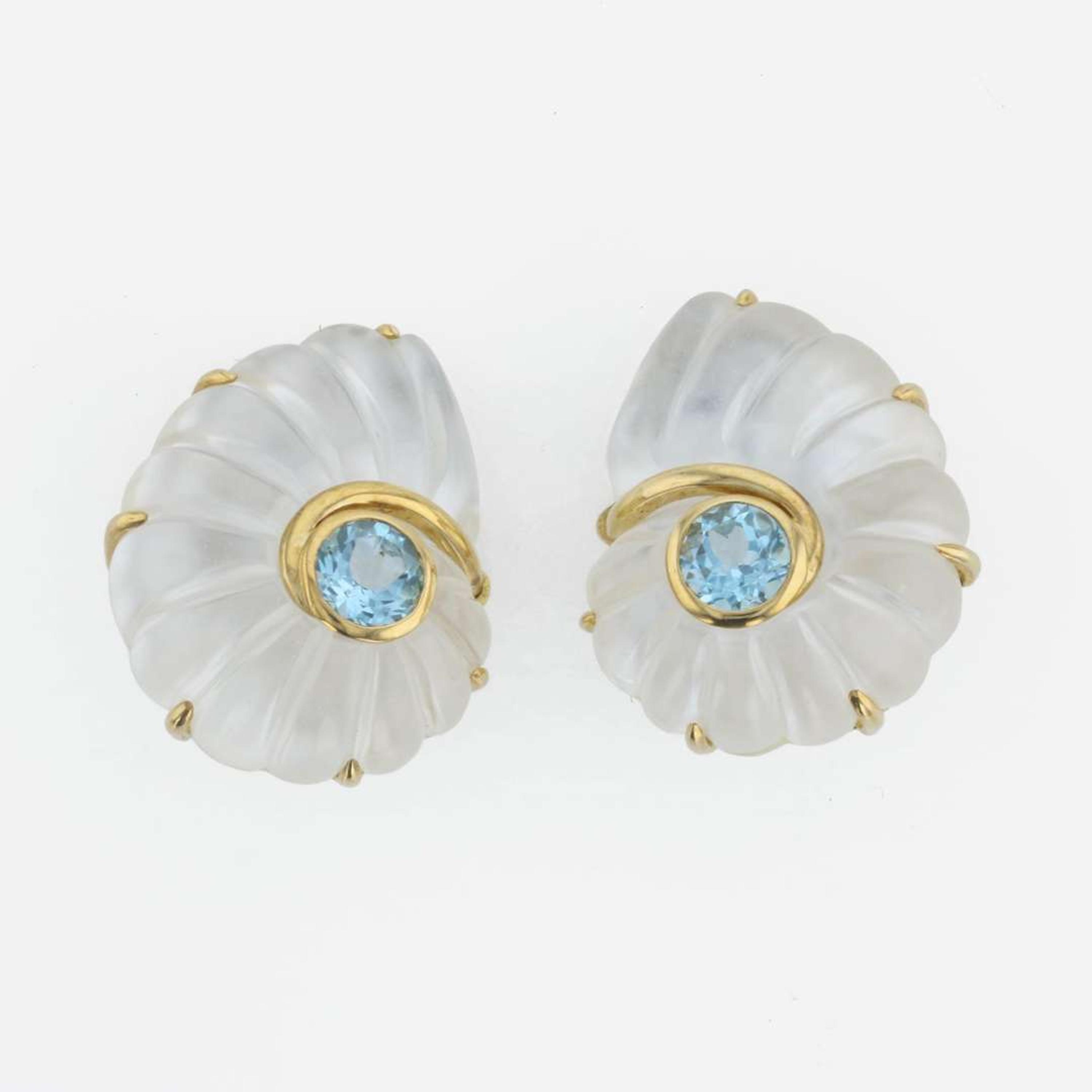 A pair of 18K yellow gold, rock crystal, and blue topaz ear clips, Trianon Nautilus