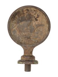 A Pair of Cast Iron Kettle Toppers and Two Trivets
