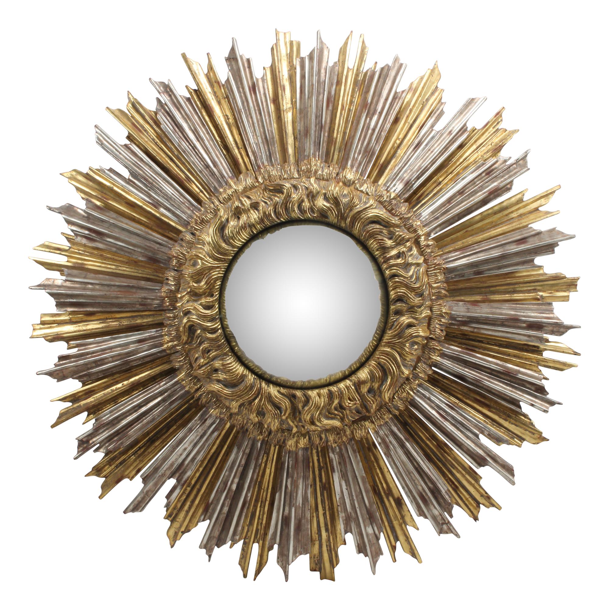 An Oversized Silvered and Giltwood Sunburst Mirror