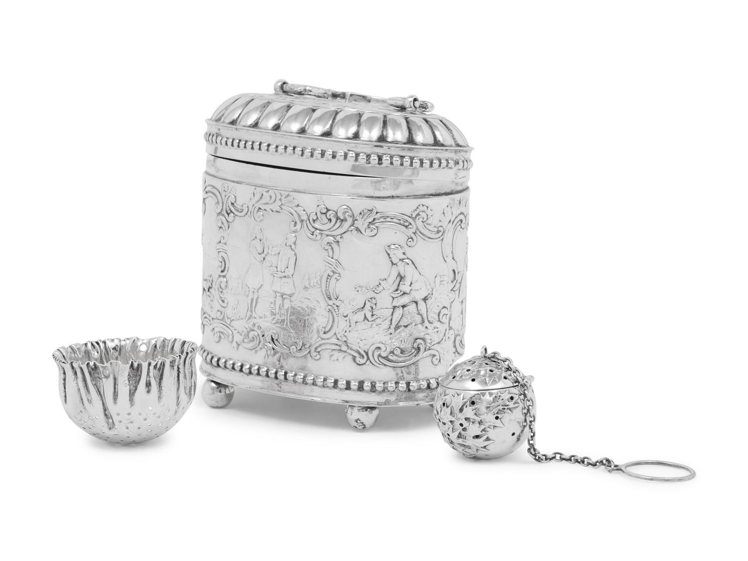 A Continental Silver Tea Caddy, Strainer and Tea Ball