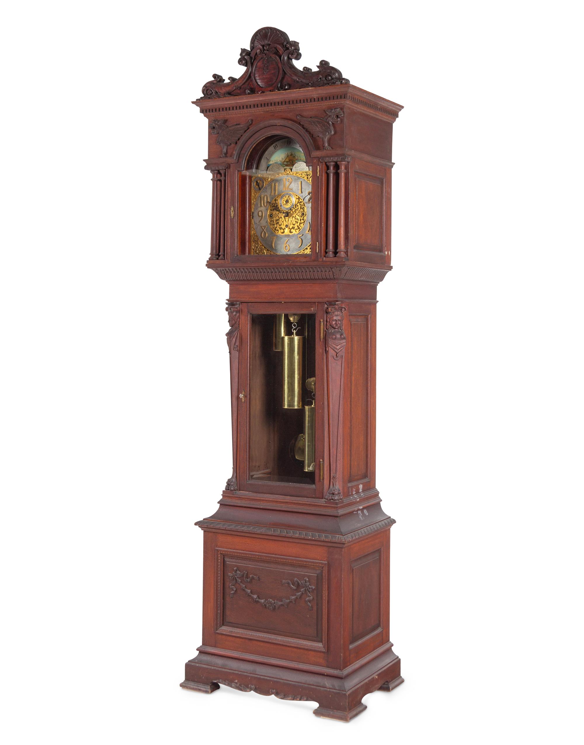 A Renaissance Revival Carved Walnut Tall Case Clock