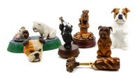 A Group of Seven Bulldog Figures Width of widest 10 inches.