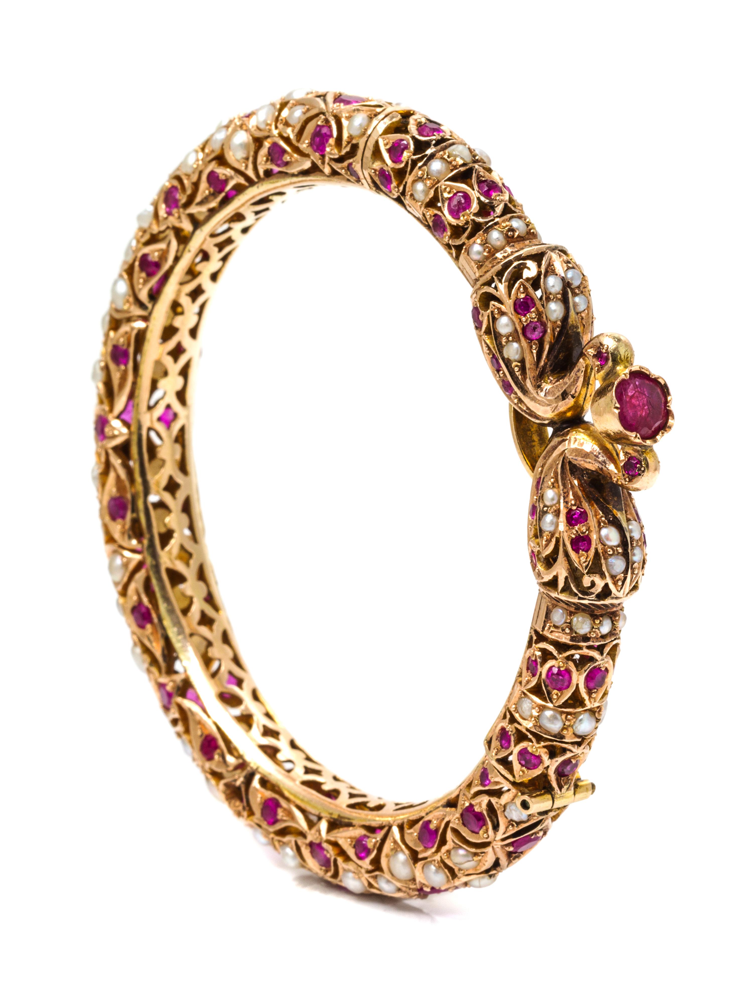 A Rose Gold, Ruby and Cultured Pearl Bracelet, 31.60 dwts.