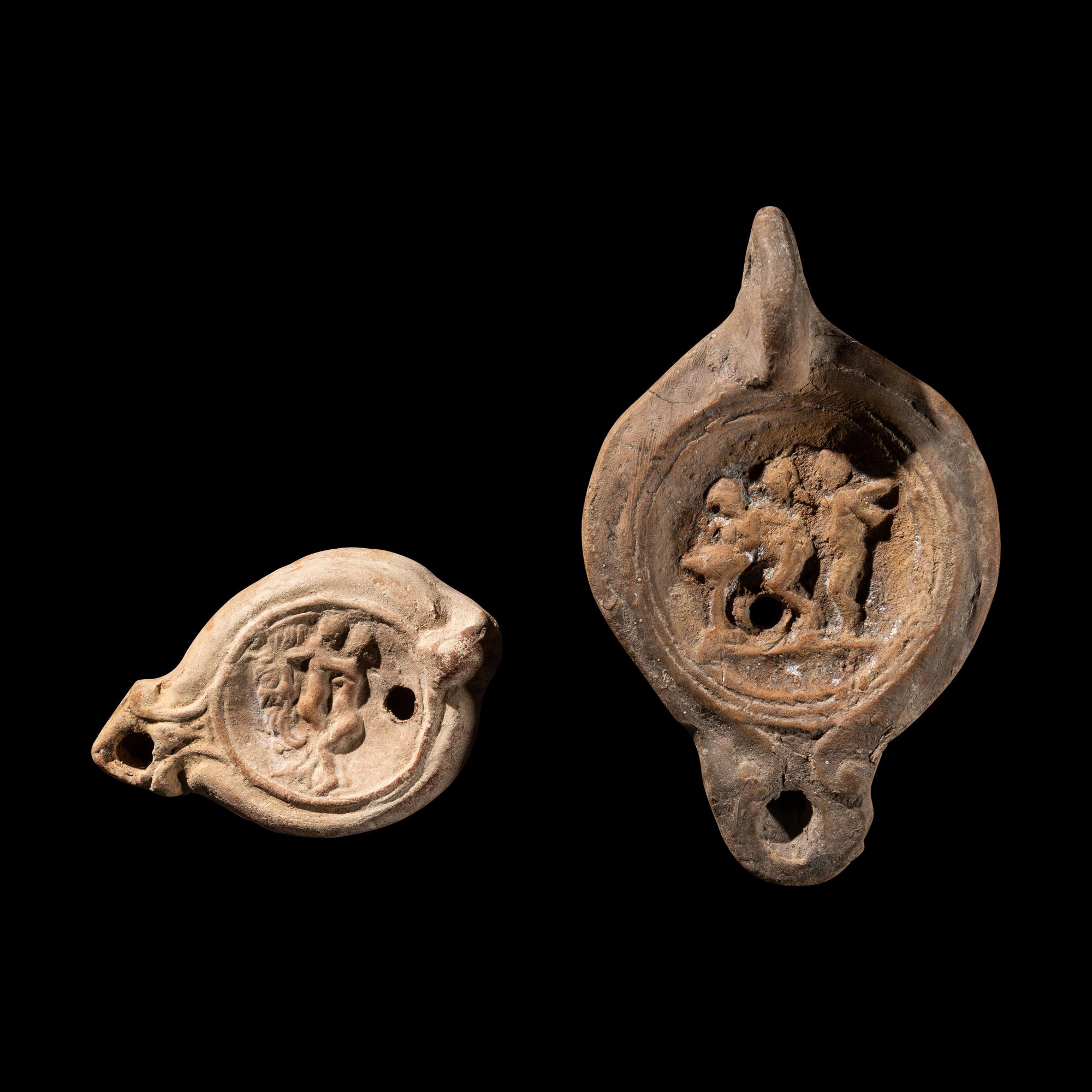 Two Roman Terracotta Lamps with Erotic Scenes