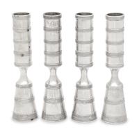 A Set of Four Danish Silvered Metal Candlesticks
