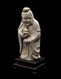 A Chinese Burnt Jade Figure of a Foreigner