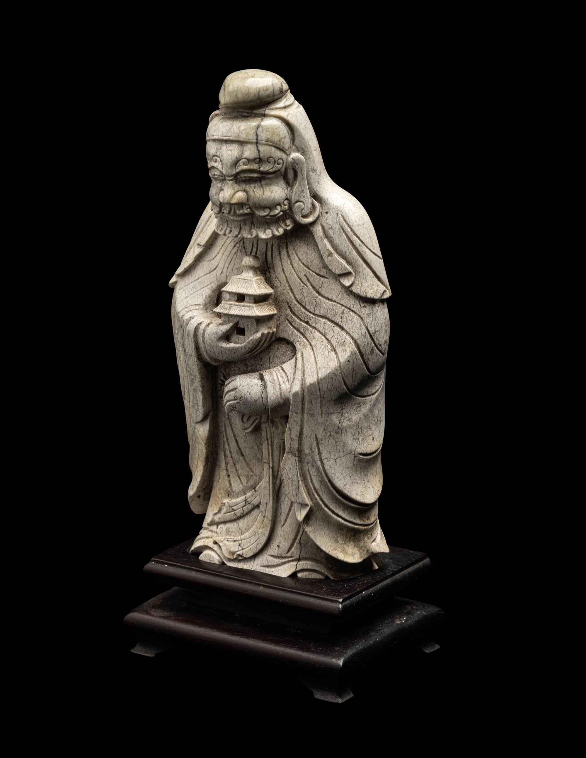 A Chinese Burnt Jade Figure of a Foreigner
