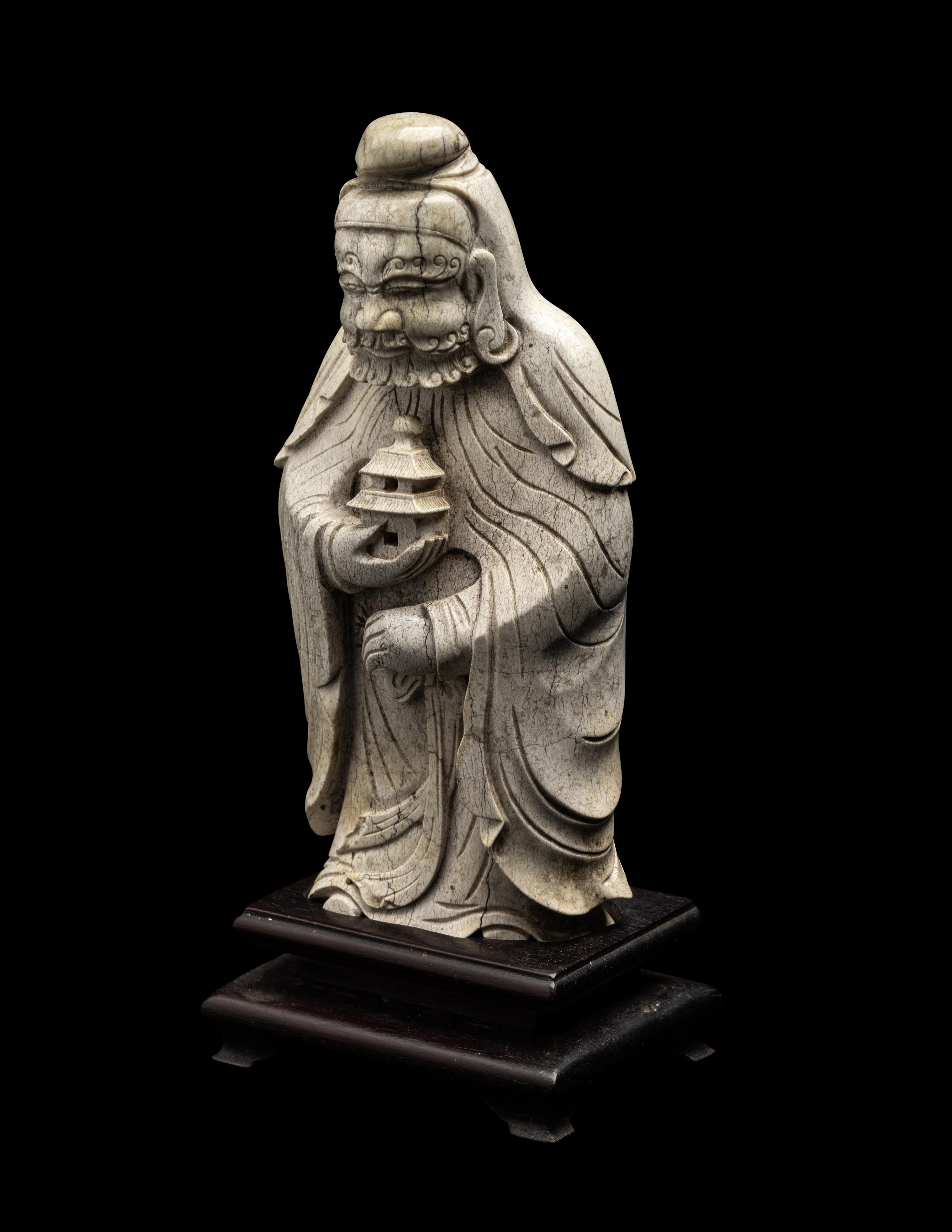 A Chinese Burnt Jade Figure of a Foreigner