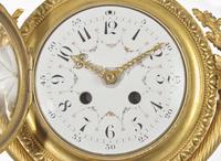 A Louis XVI Style Gilt Bronze and Enameled Porcelain Cartel Clock