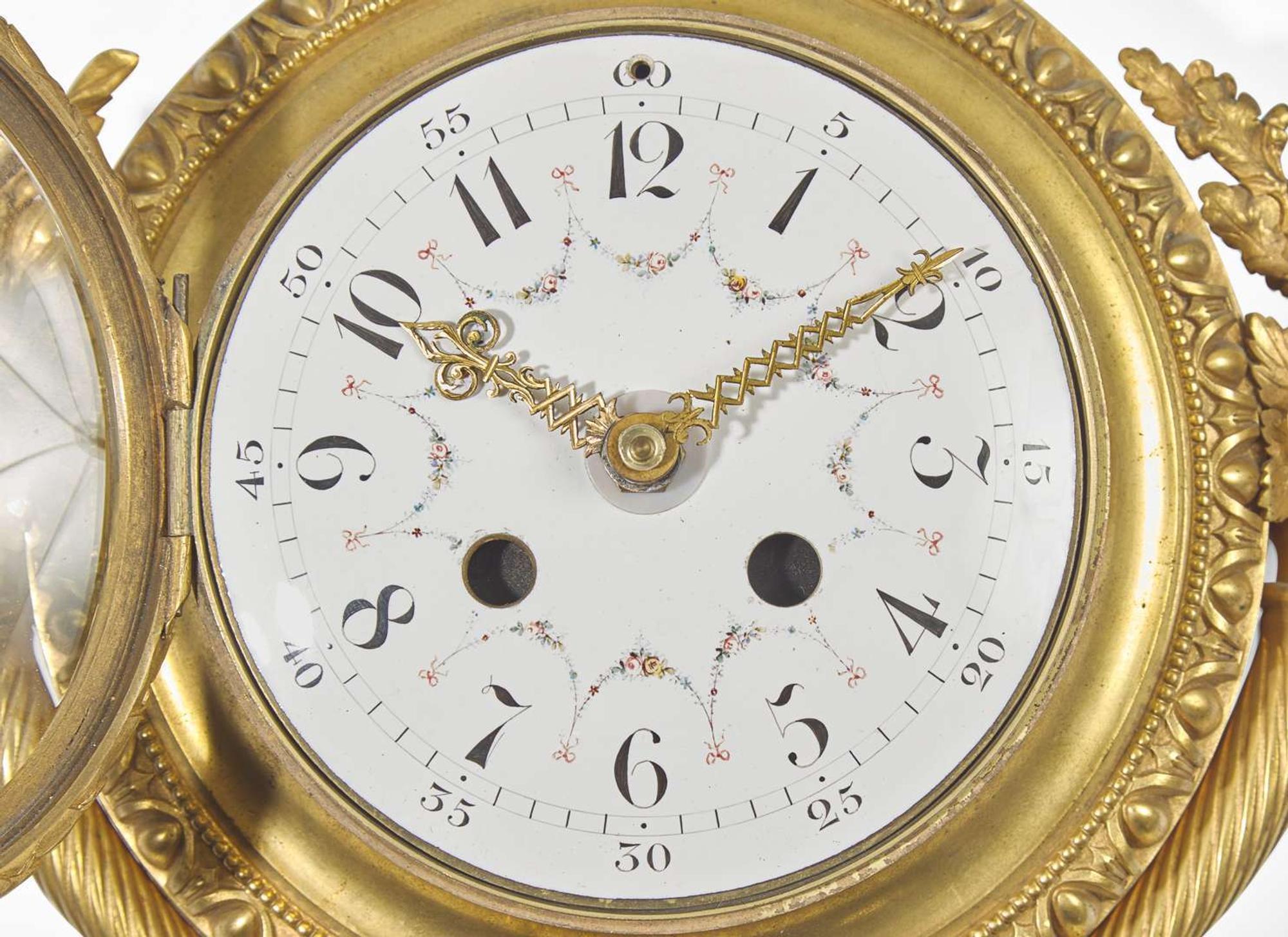 A Louis XVI Style Gilt Bronze and Enameled Porcelain Cartel Clock