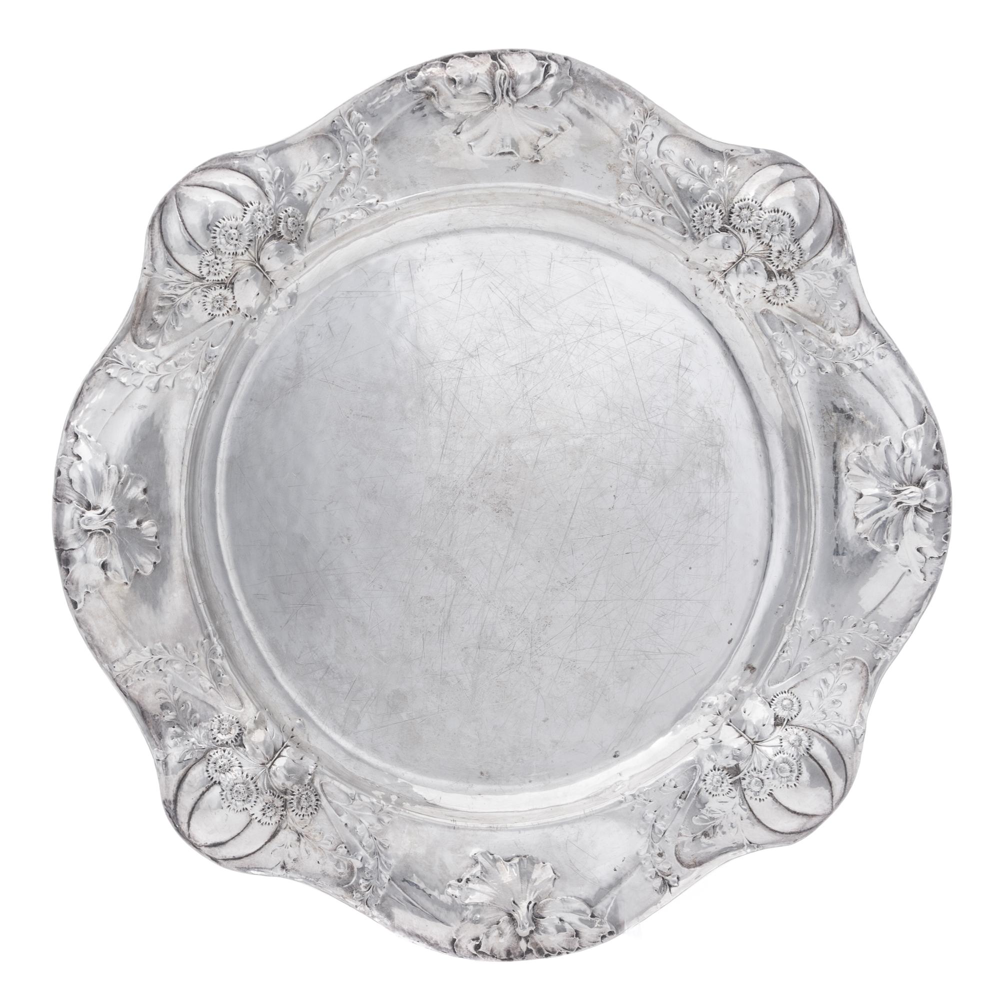 An American Silver Martele Entree Dish, Gorham Mfg. Co., Providence, RI, 1908, shaped circular, the undulating border chased with gourd