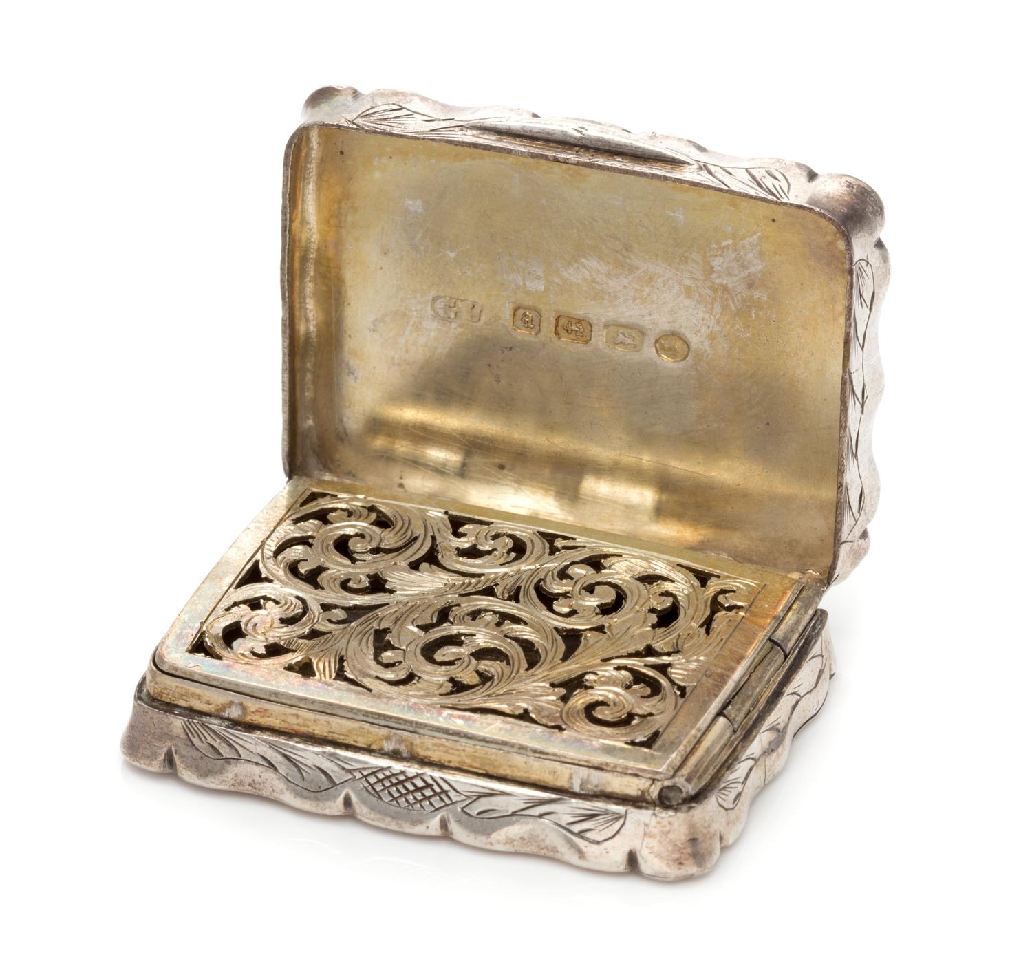 A Victorian Silver Vinaigrette, George Unite & Sons, Birmingham, 1875, the case having floral and geometric decoration, the lid centere