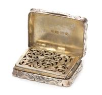 A Victorian Silver Vinaigrette, George Unite & Sons, Birmingham, 1875, the case having floral and geometric decoration, the lid centere