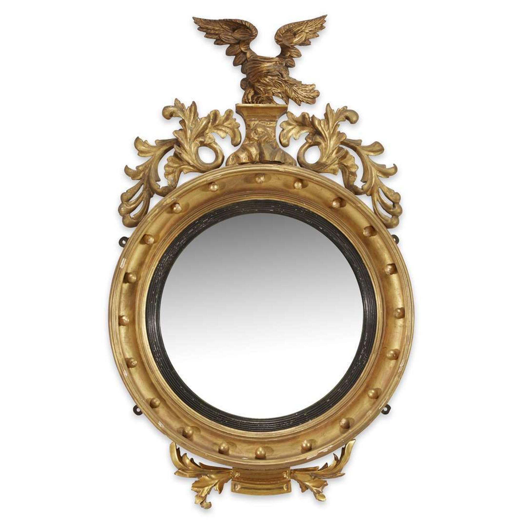 Classical giltwood bull's-eye looking glass early 19th century