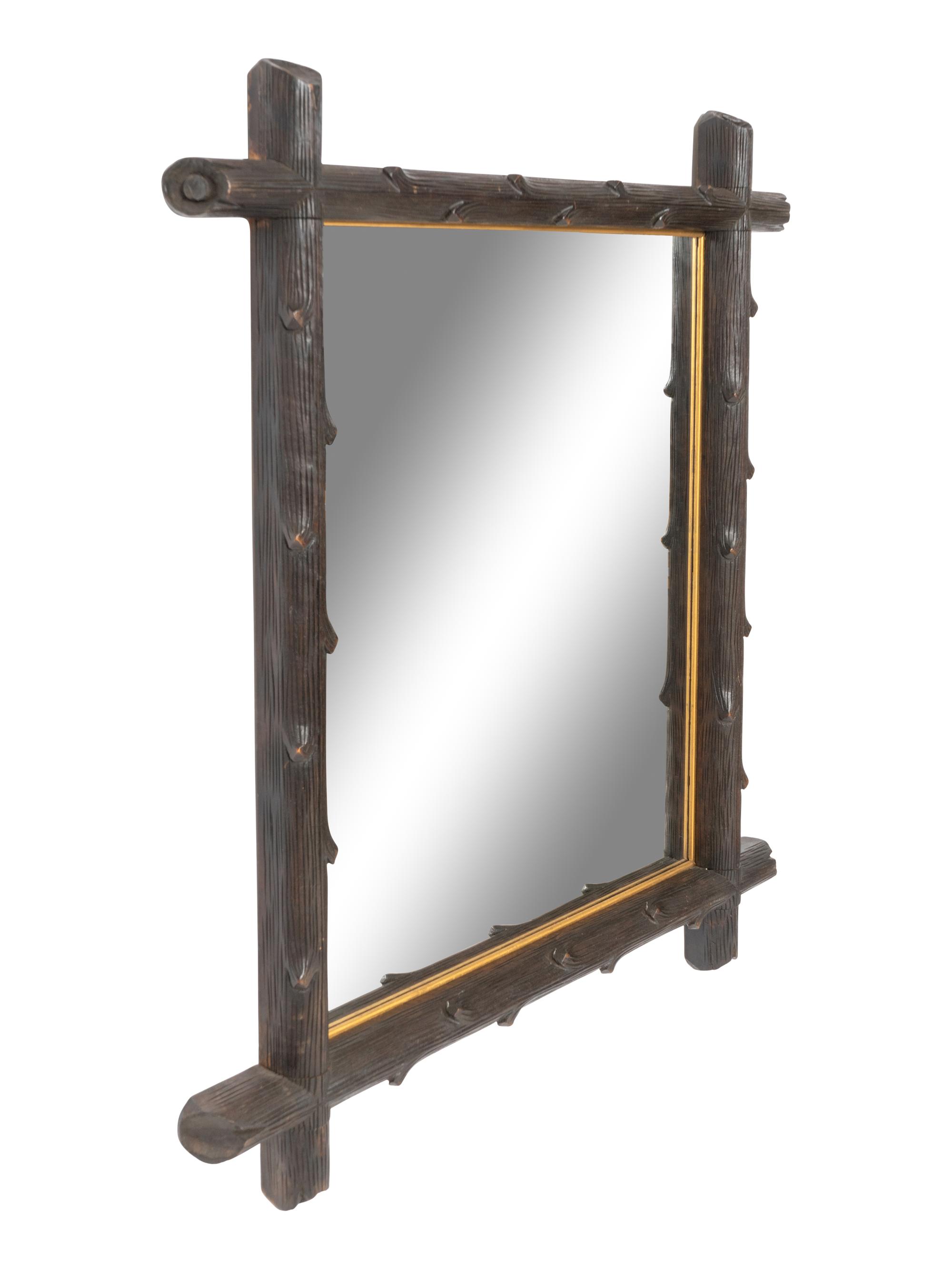 A Black Forest Faux Bois Carved Mirror