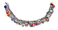 A Silver Charm Bracelet with Numerous Attached Polychrome Enamel Travel Charms, 48.20 dwts.