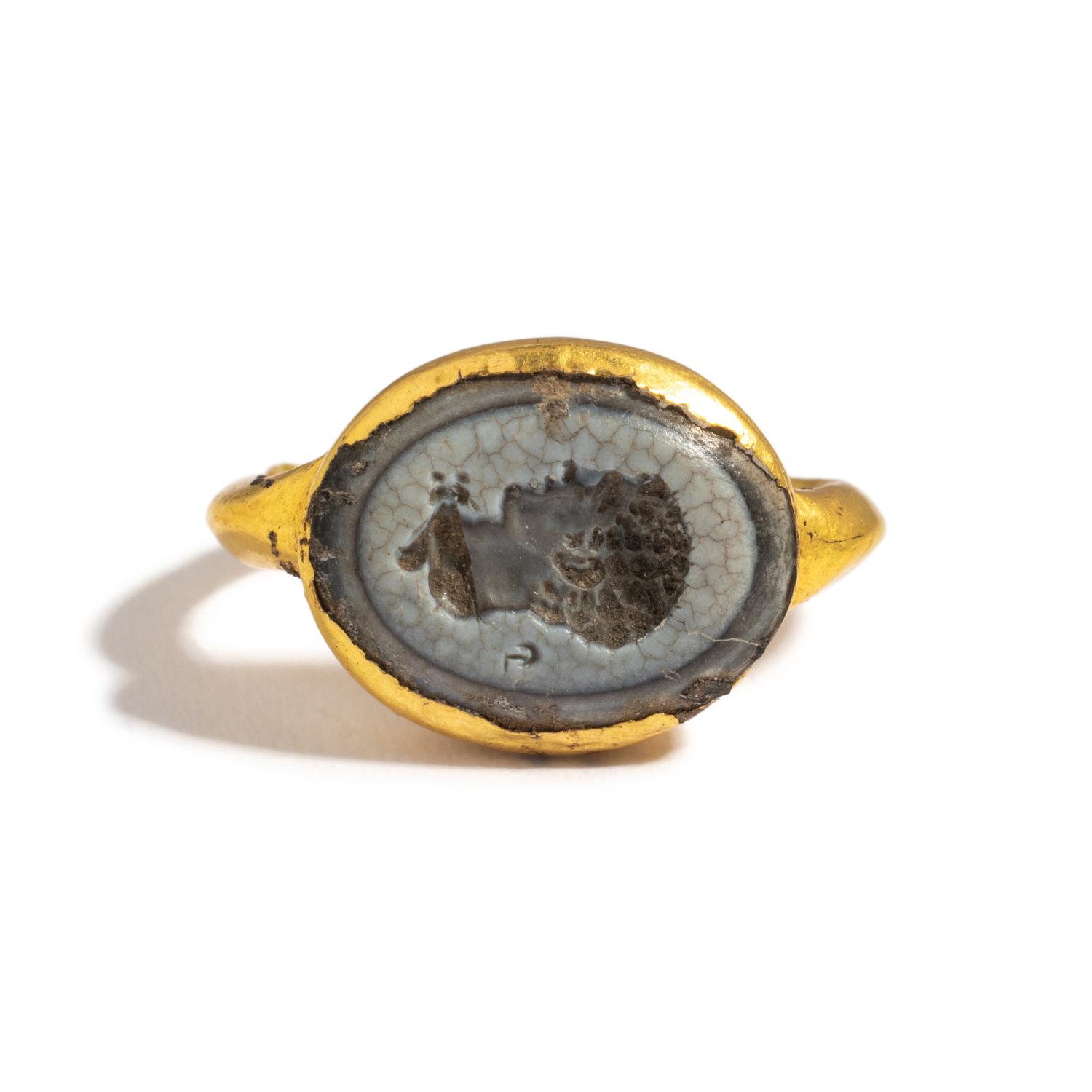 A Roman Gold and White Glass Finger Ring with a Male Portrait Head (Possibly a Young Hercules)