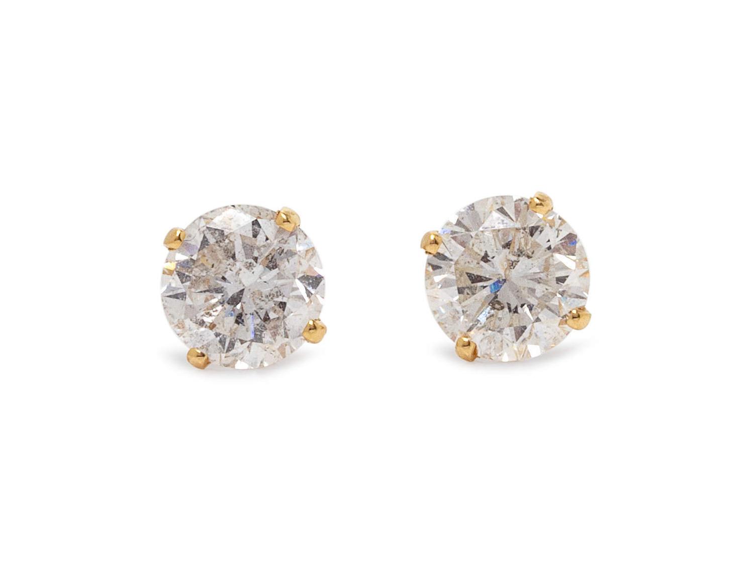 A Pair of 14 Karat Yellow Gold and Diamond Stud Earrings,