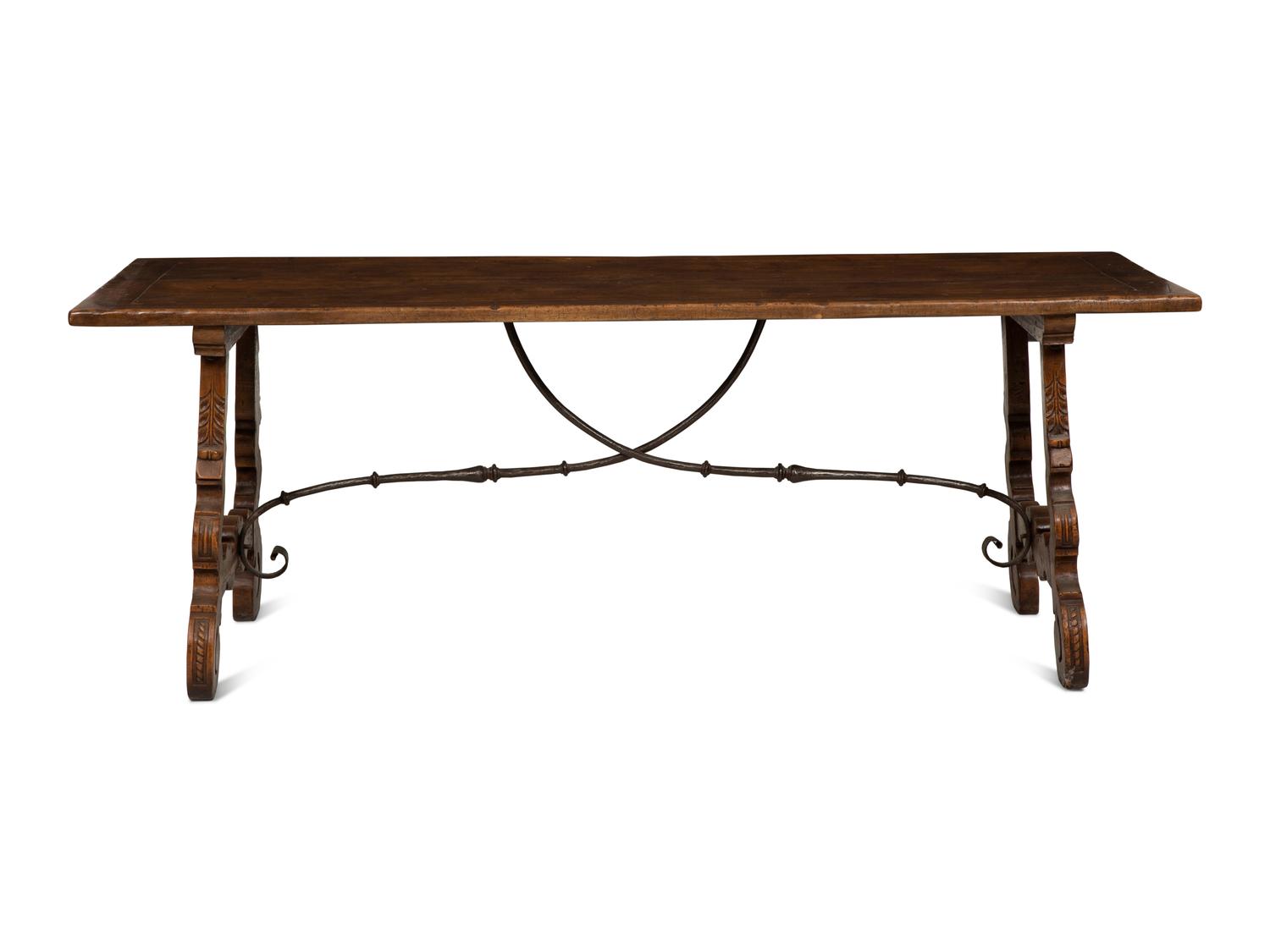 A Spanish Walnut and Wrought Iron Trestle Table