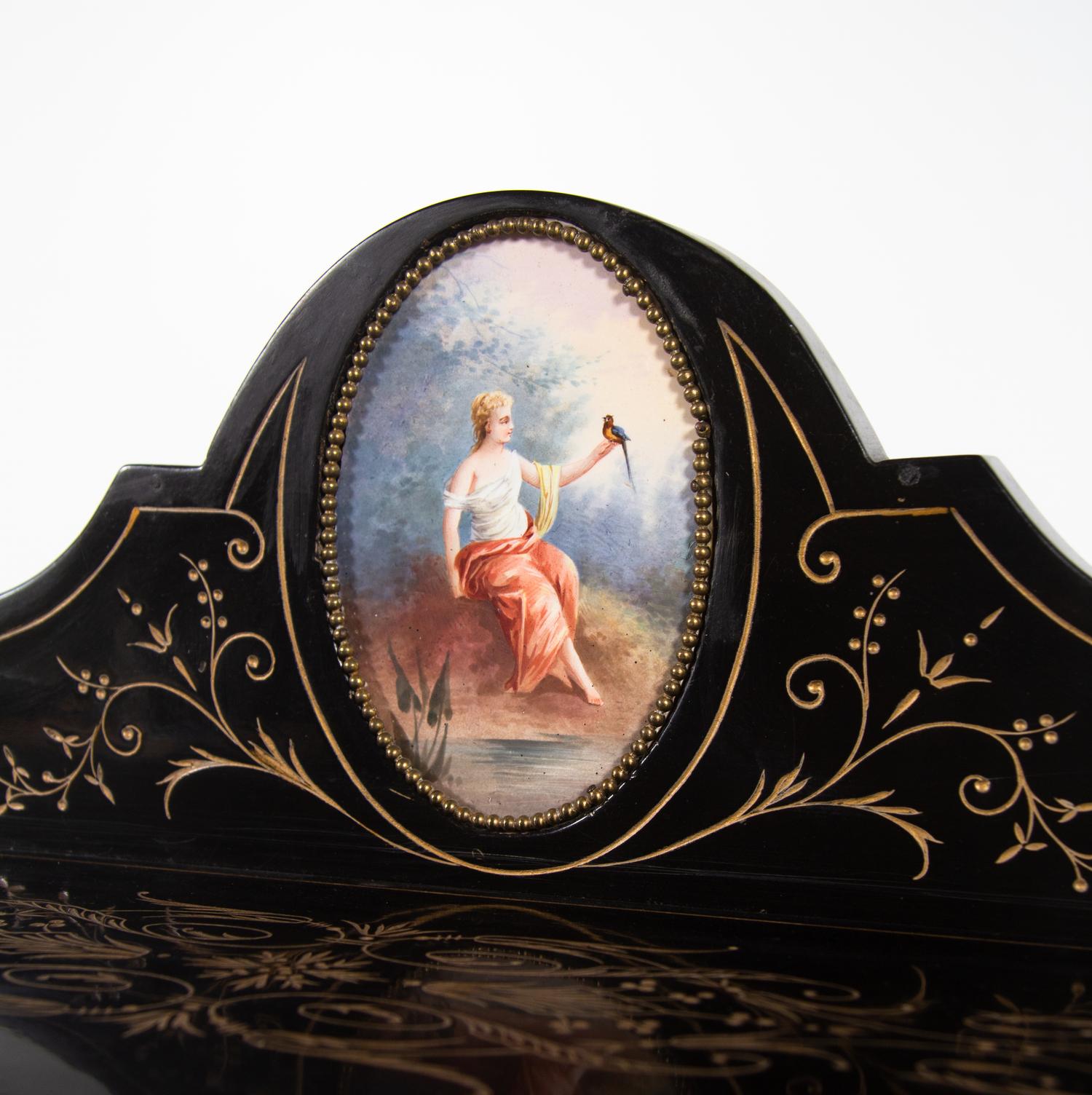 A Napoleon III Porcelain Mounted Ebonized Bonheur du Jour