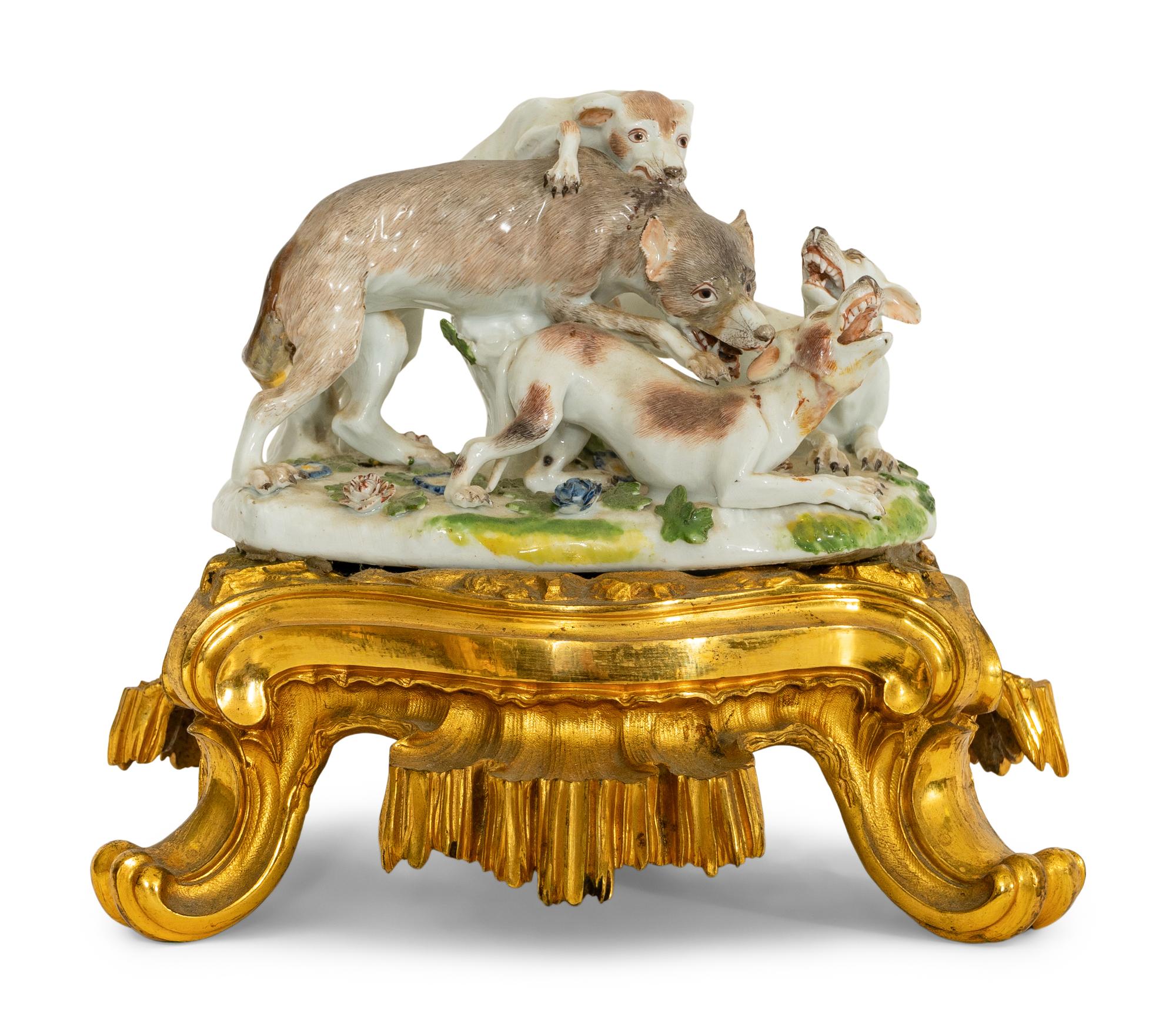 A German Porcelain Hunting Dog and Wolf Group on a Gilt Bronze Stand