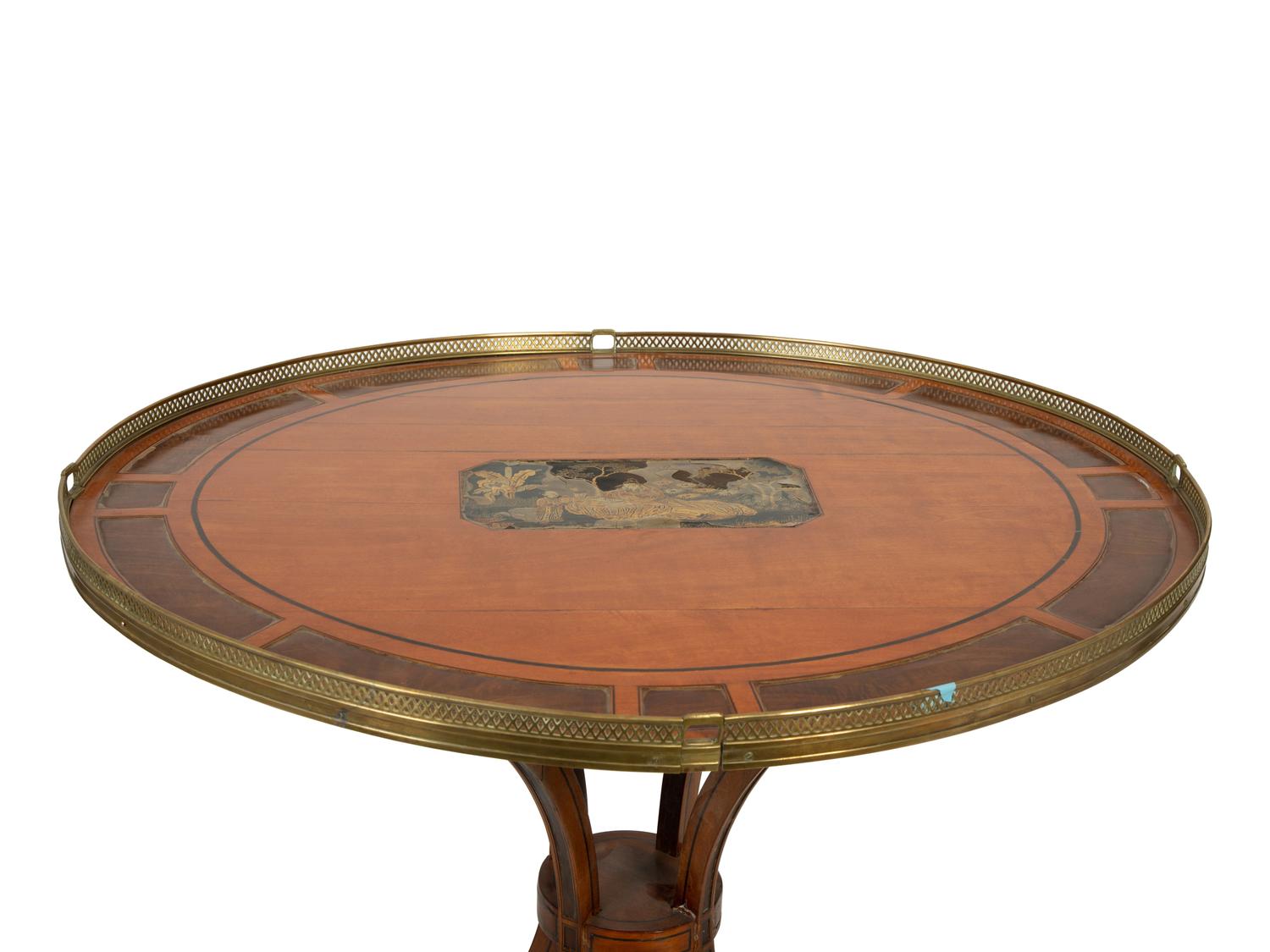 A Continental Neoclassical Style Mahogany Oval Table — 19TH CENTURY