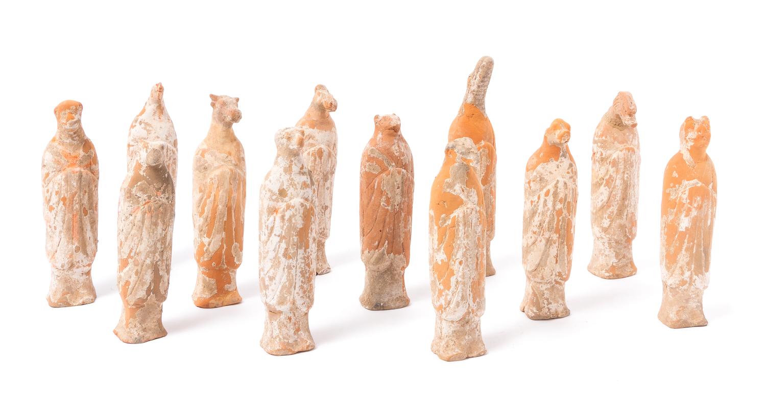 A Set of Twelve Painted Red Pottery Zodiac Figures Height of tallest 8 3/4 inches.