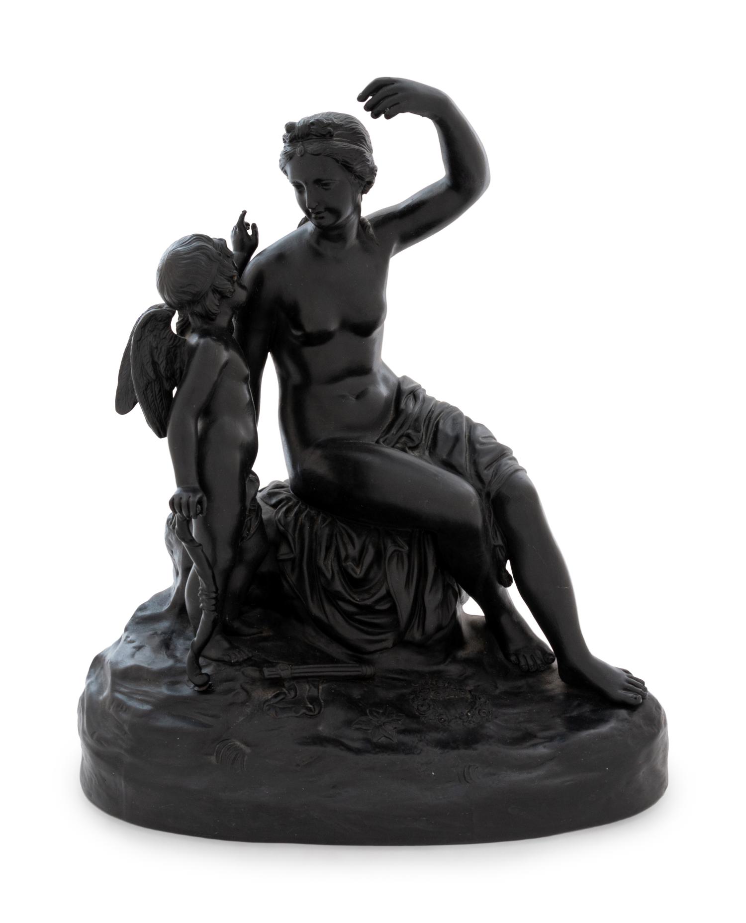 A Wedgwood Black Basalt Figural Group Depicting Cupid Disarmed