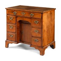 A George II Walnut Kneehole Desk