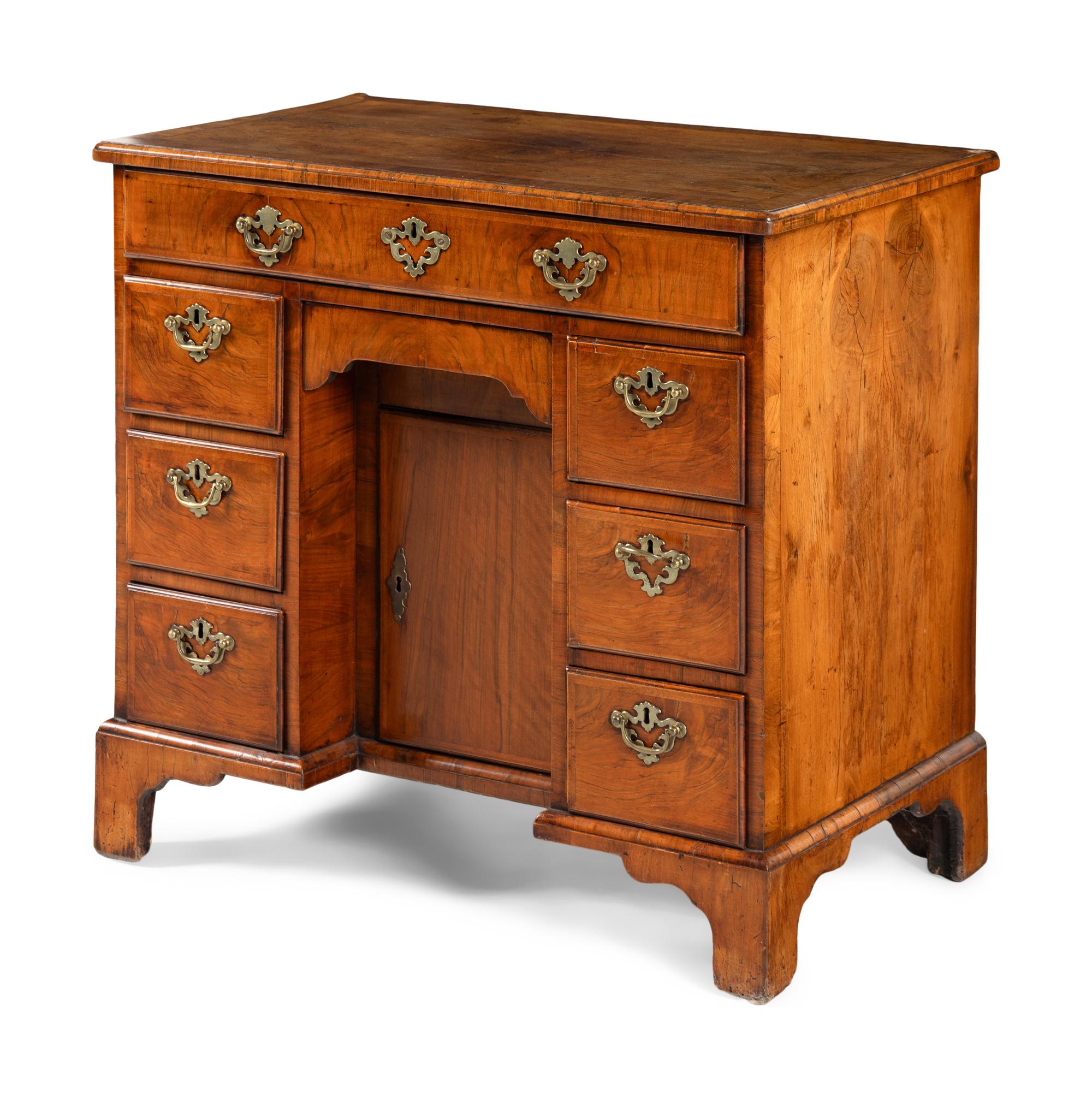 A George II Walnut Kneehole Desk