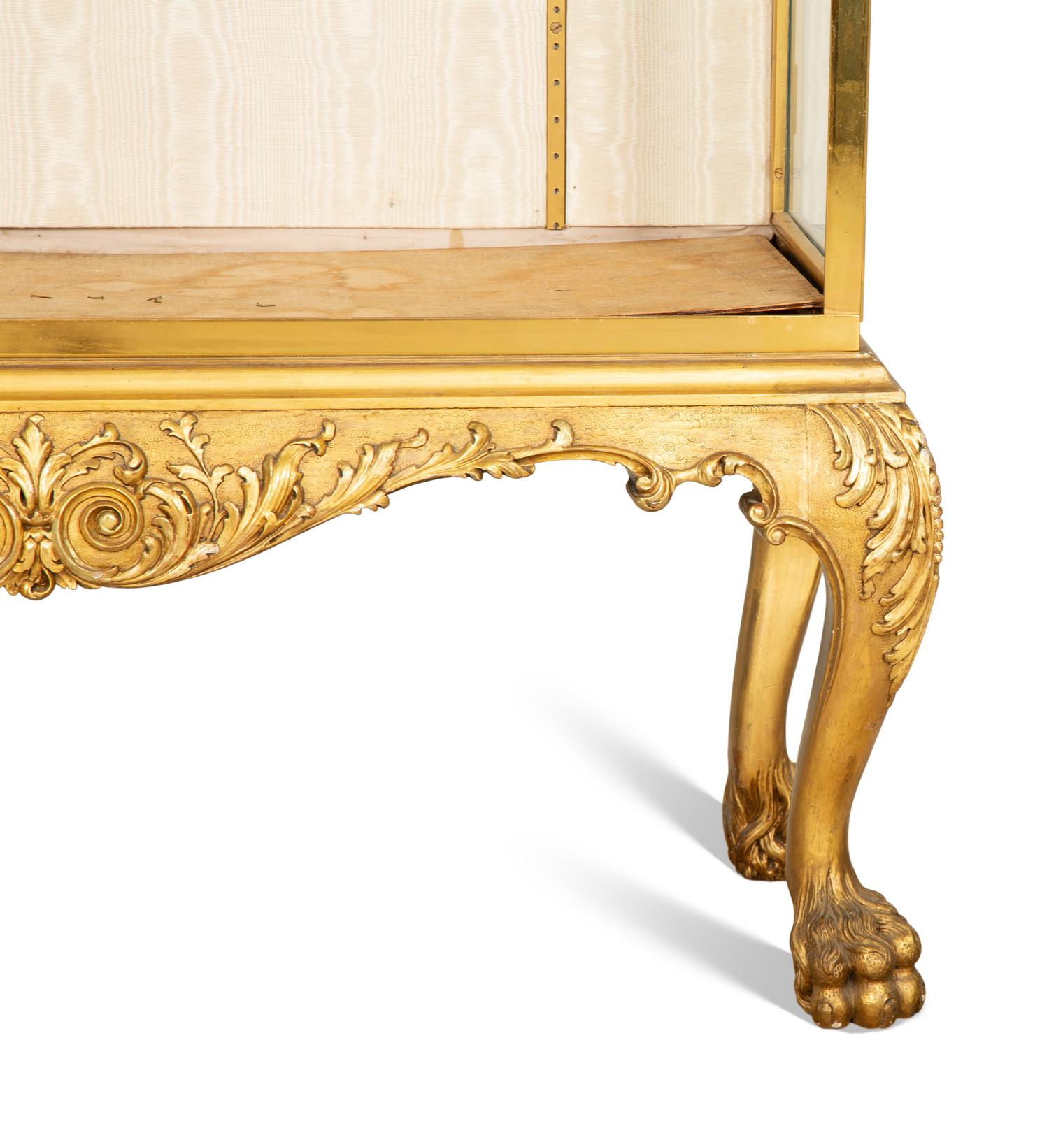 An English Brass Vitrine Cabinet on a Giltwood Base