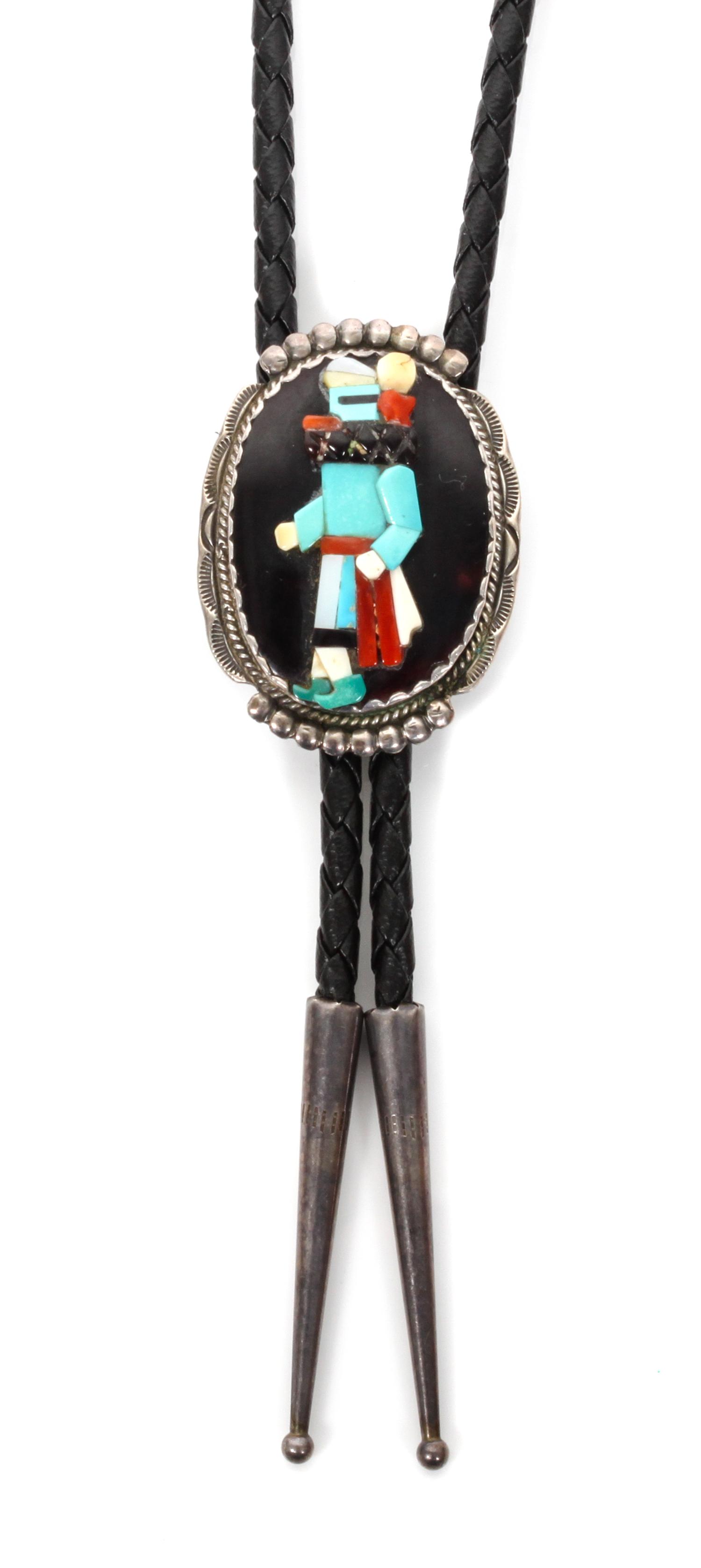 A Zuni Silver and Multiple Stone Bolo, Beverly Etsate Height 1 5/8 x width 1 1/4 inches.