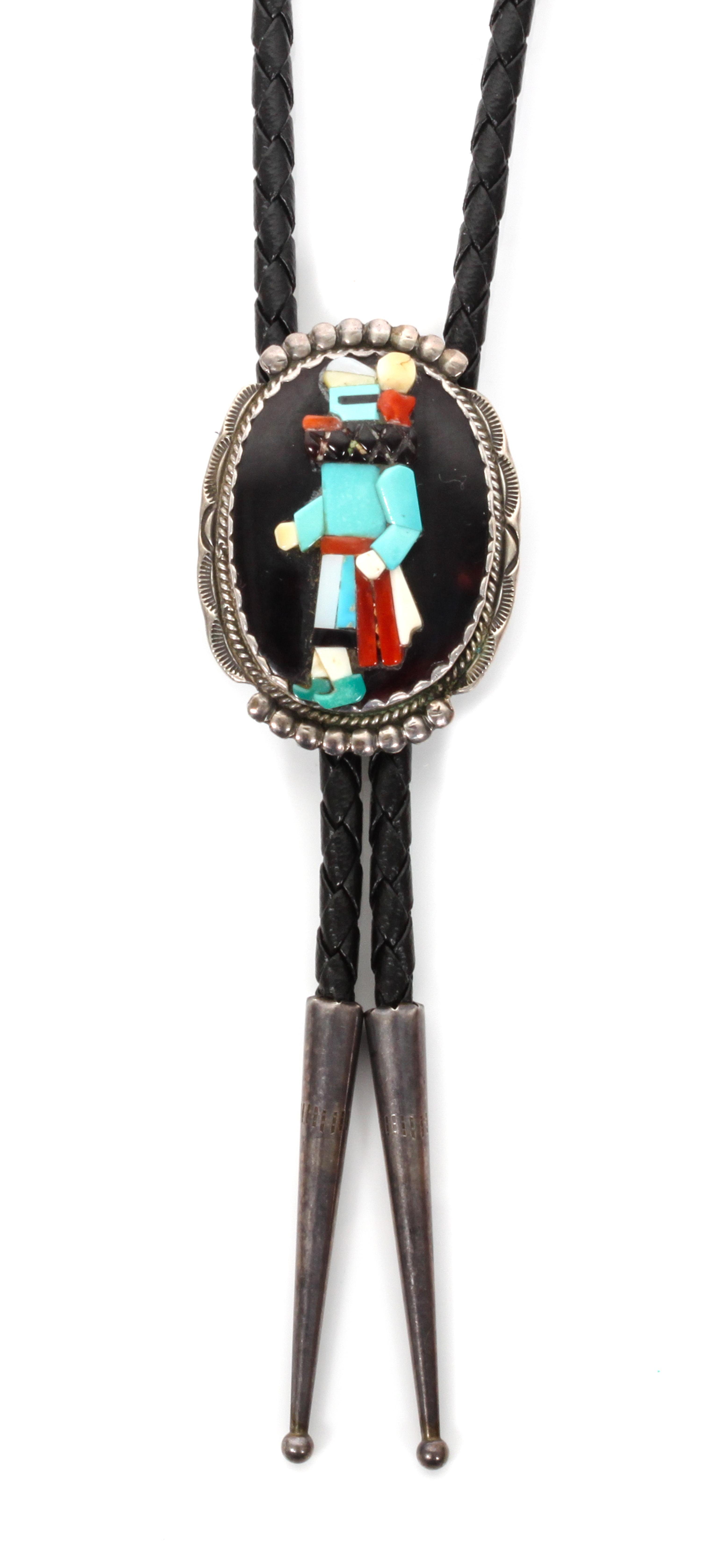 A Zuni Silver and Multiple Stone Bolo, Beverly Etsate Height 1 5/8 x width 1 1/4 inches.