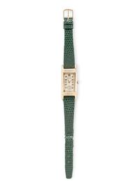 GRUEN, REF. 279 YELLOW GOLD AND STEEL 'CURVEX' WATCH
