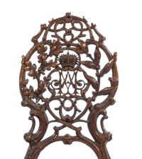 A Pair of Black Forest Pierce Carved Side Chairs Height of tallest 41 1/4 inches. — 19TH CENTURY