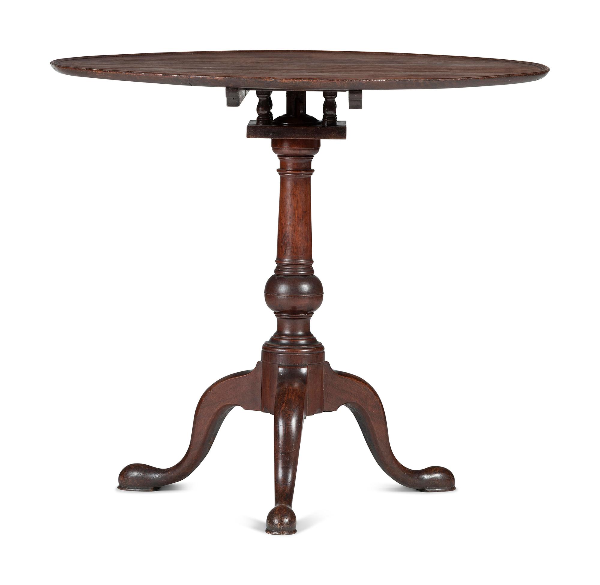 A Chippendale Carved and Figured Mahogany Tilt-Top Tea Table