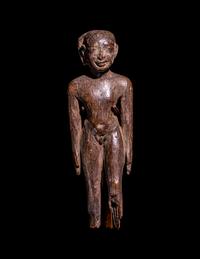 An Egyptian Wood Figure of a Youth
