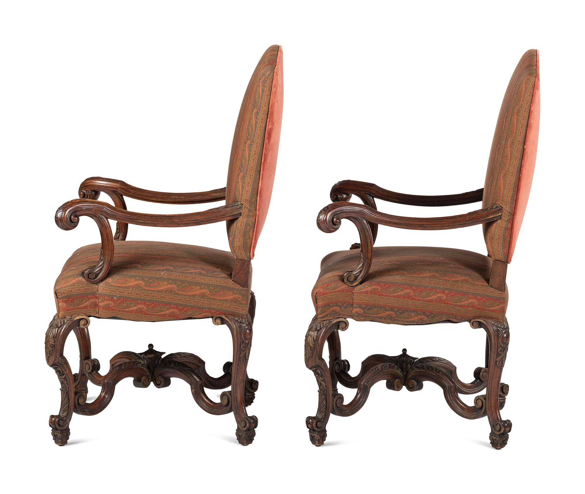 A Pair of Louis XV Style Carved Walnut Fauteuils