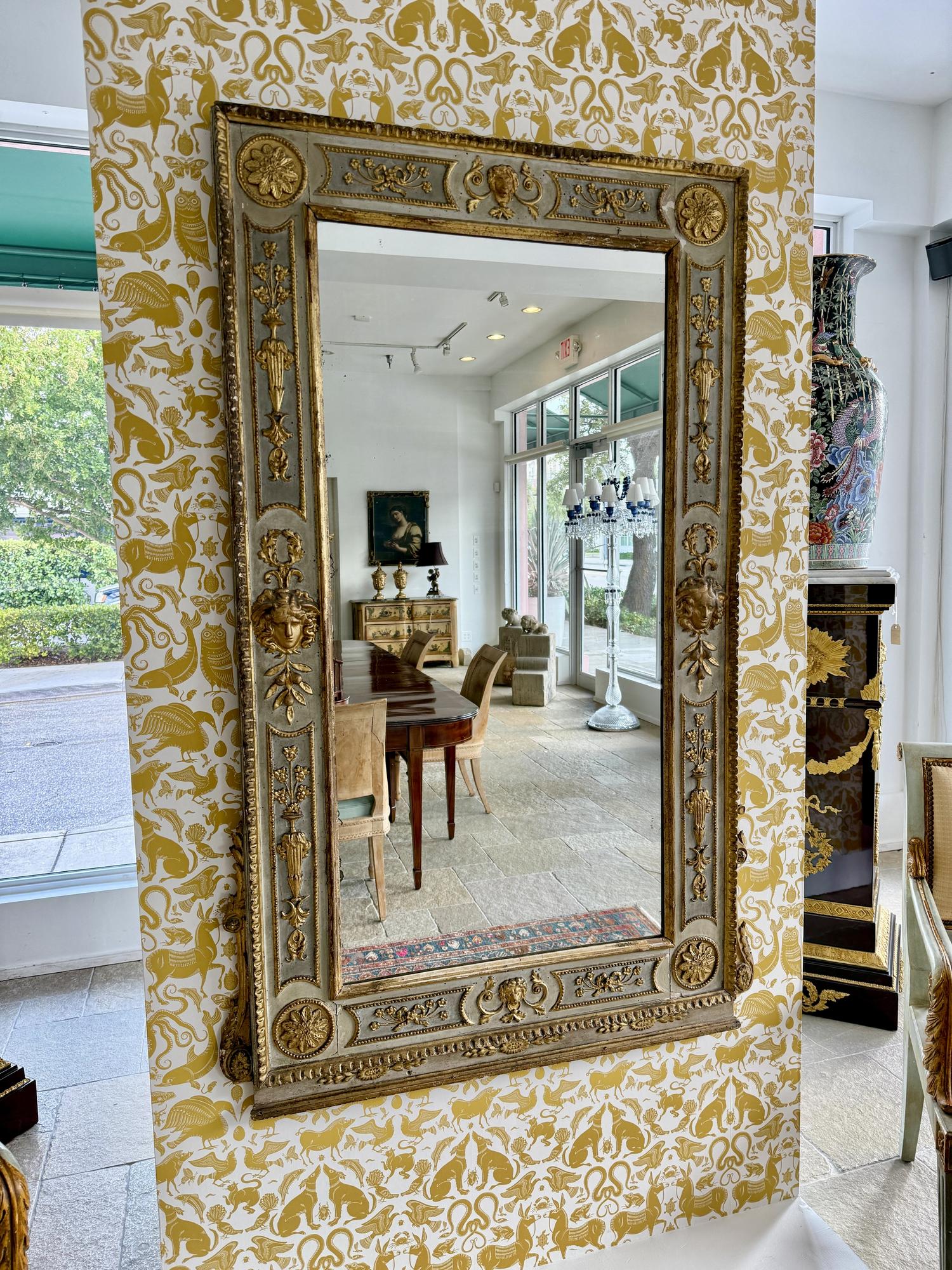 A North Italian Neoclassical Blue Painted and Parcel Gilt Mirror